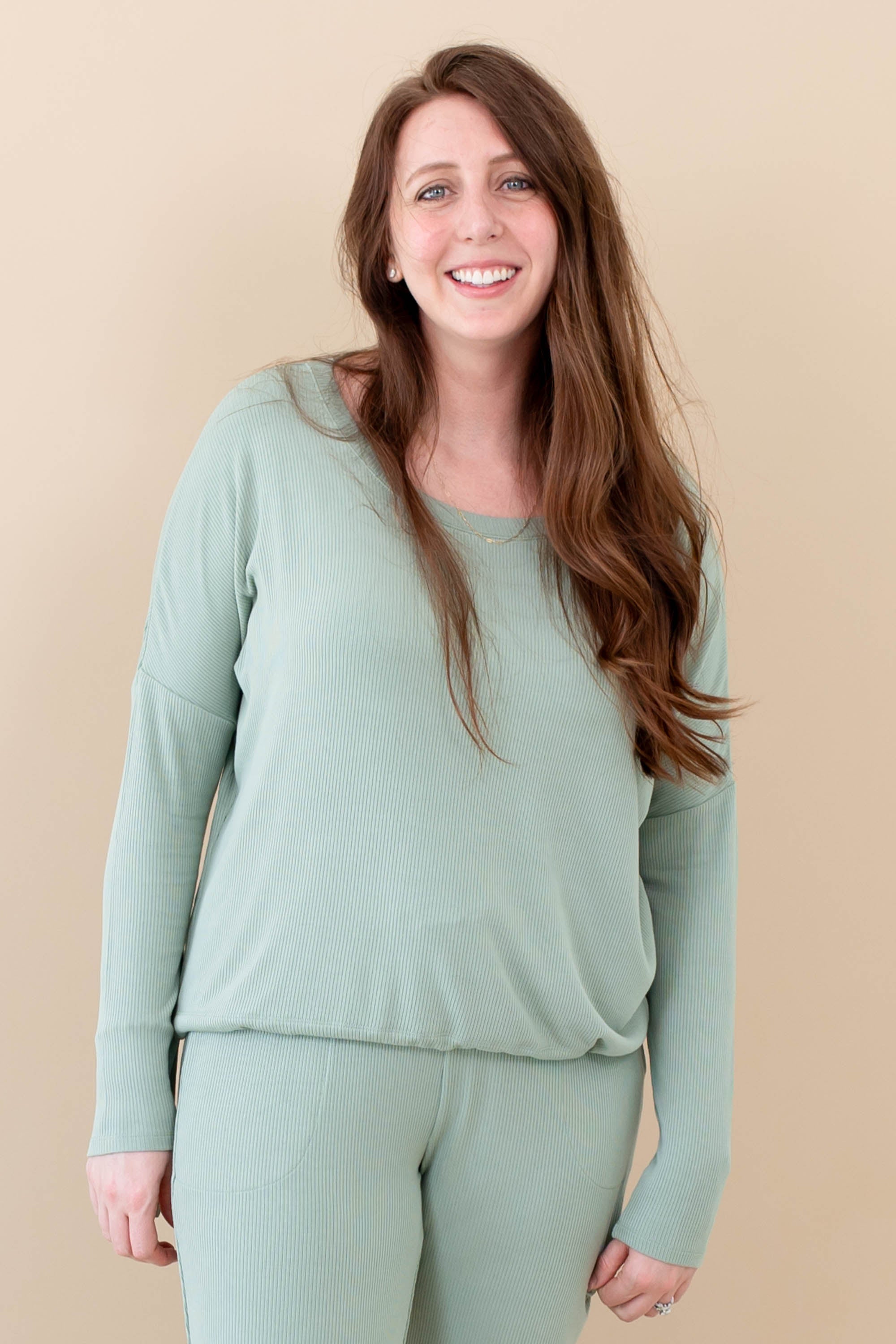 Model wearing the Women's Ribbed Long Sleeve Drop Shoulder Top in Thyme and Thyme Wide Leg Pants
