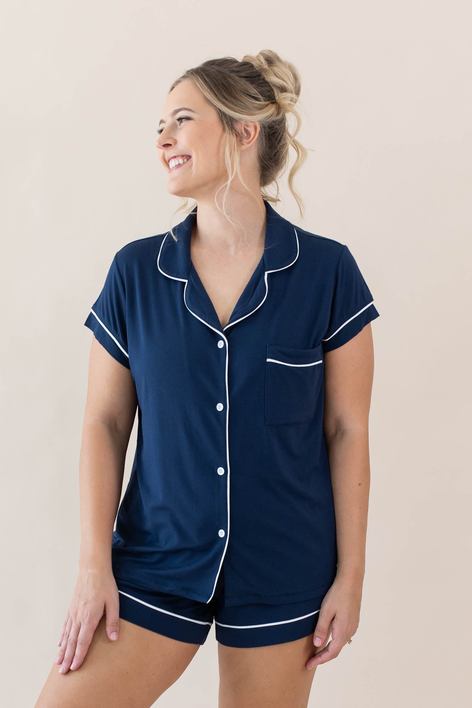 Female modeling Women's Short Sleeve Pajama Set in Navy with Cloud Trim