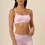 Brunette woman modeling the Women's Boxer in Peony paired with the Scoop Neck Bralette in Peony