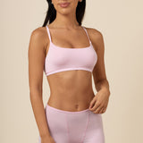 Brunette woman modeling the Women's Boxer in Peony paired with the Scoop Neck Bralette in Peony