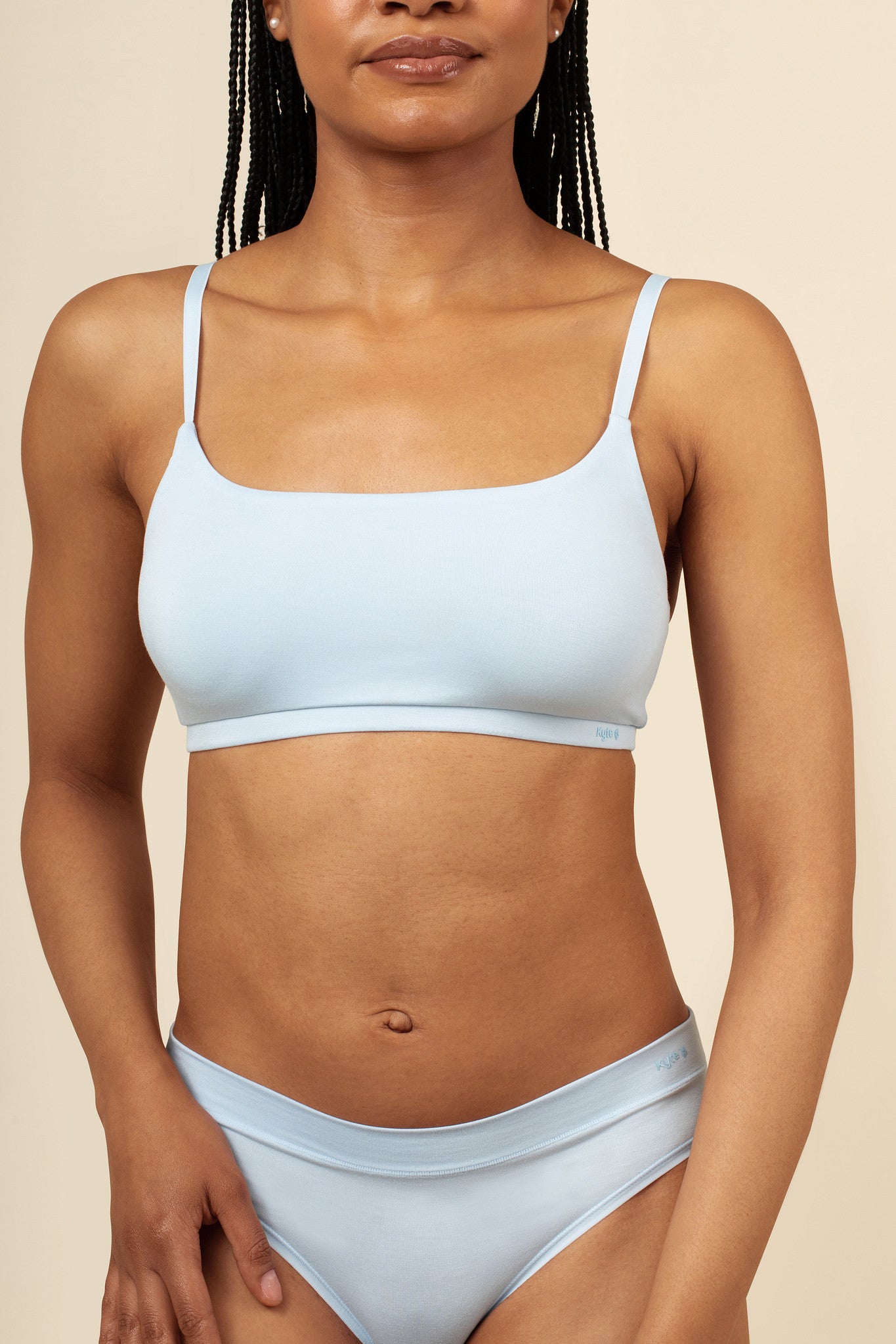 Close up of a model wearing the Women's Scoop Neck Bralette in Breeze  paired with matching briefs ::: Model is 32C" wearing size S ///