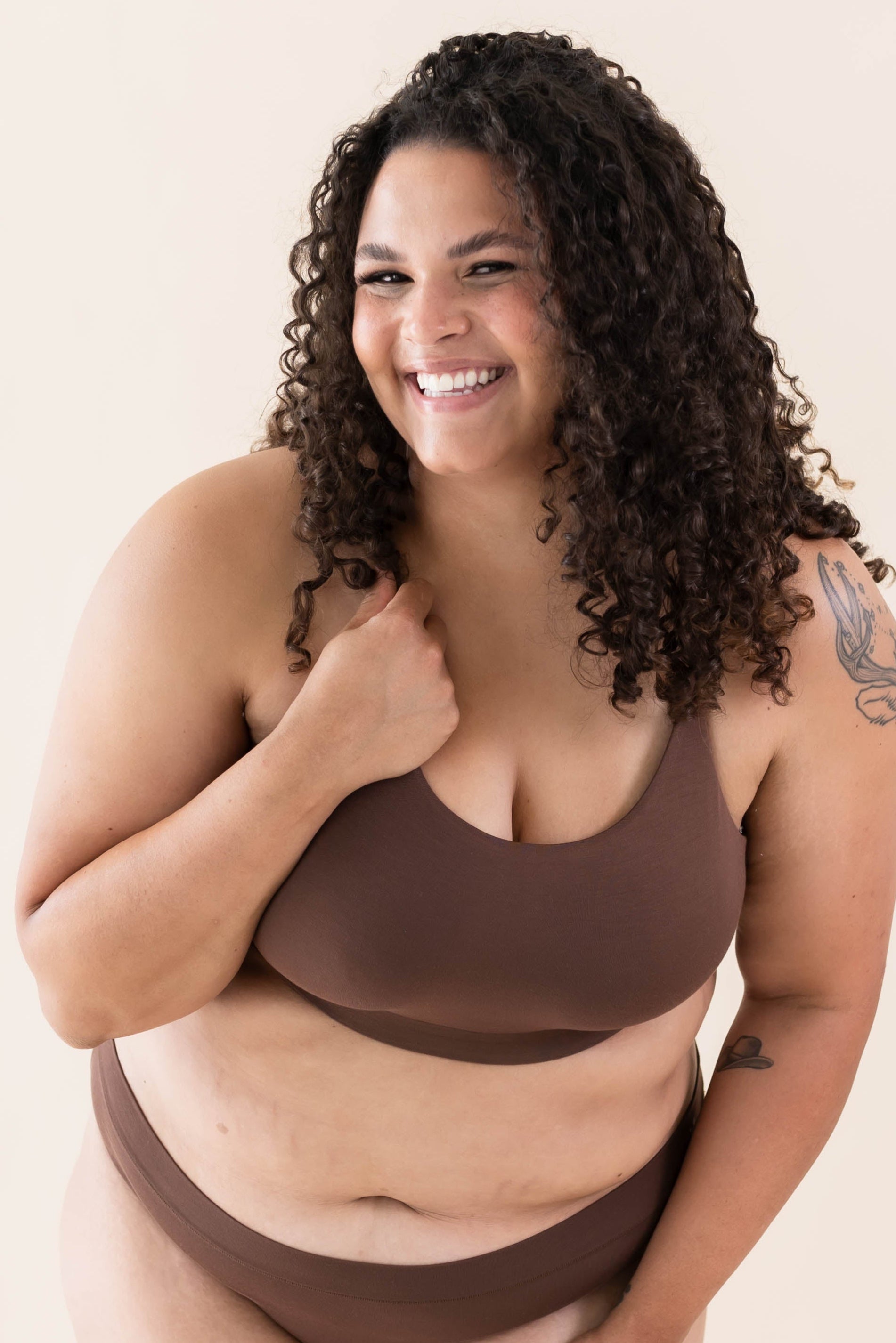 Model wearing the Kyte Baby's Women's Scoop Neck Bralette in Toffee