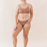Model wearing Kyte Baby's Women's Scoop Neck Bralette in Latte