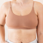 Close up of model wearing the Kyte Baby's Women's Scoop Neck Bralette in Latte