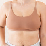 Close up of model wearing the Kyte Baby's Women's Scoop Neck Bralette in Latte