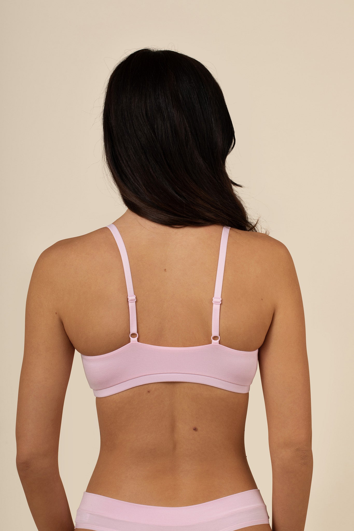 Back of the Women's Scoop Neck Bralette in Peony on a model showcasing the straps