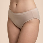 Beige underwear worn by a person on a beige background