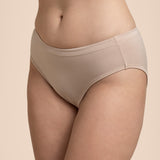 Beige underwear worn by a person on a beige background