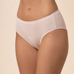 Light pink mid-waisted underwear on a beige background