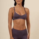 Brunette model wearing the Women's V-Neck Bra and Boxers in  Currant