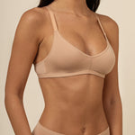Woman modeling the Women's V-Neck Bra in Chai  paired with matching Women's Boxers ::: Model is 32C wearing size S ///