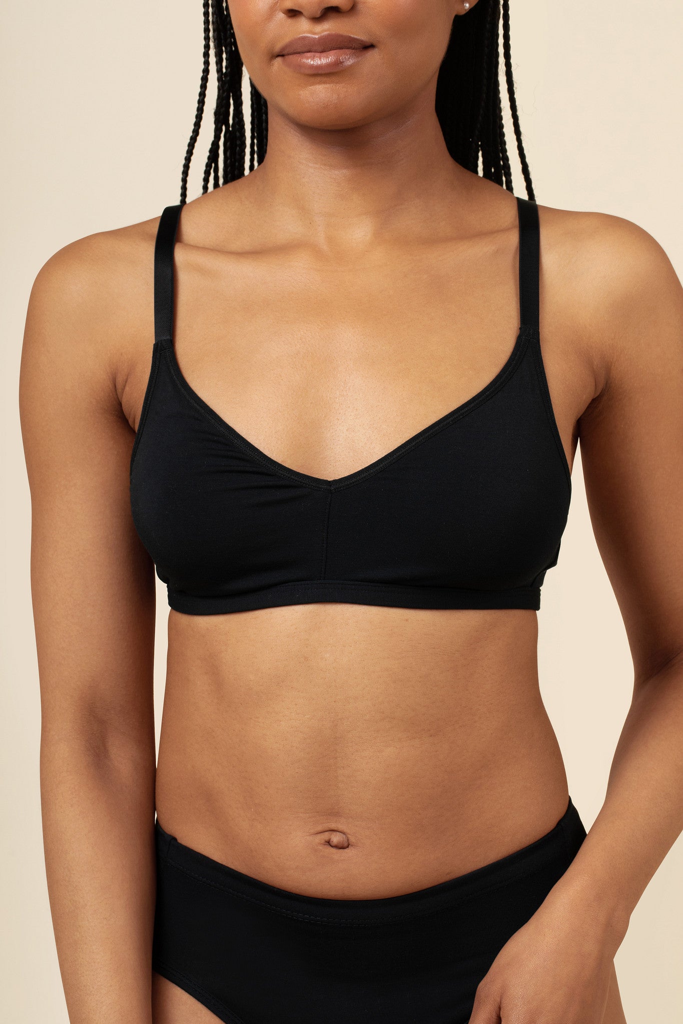 Woman modeling the Women's V Neck Bra in Midnight paired with matching briefs ::: Model is 32C wearing size S ///
