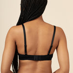 Model showcasing the back and straps of the Women's V-Neck Bra in Midnight