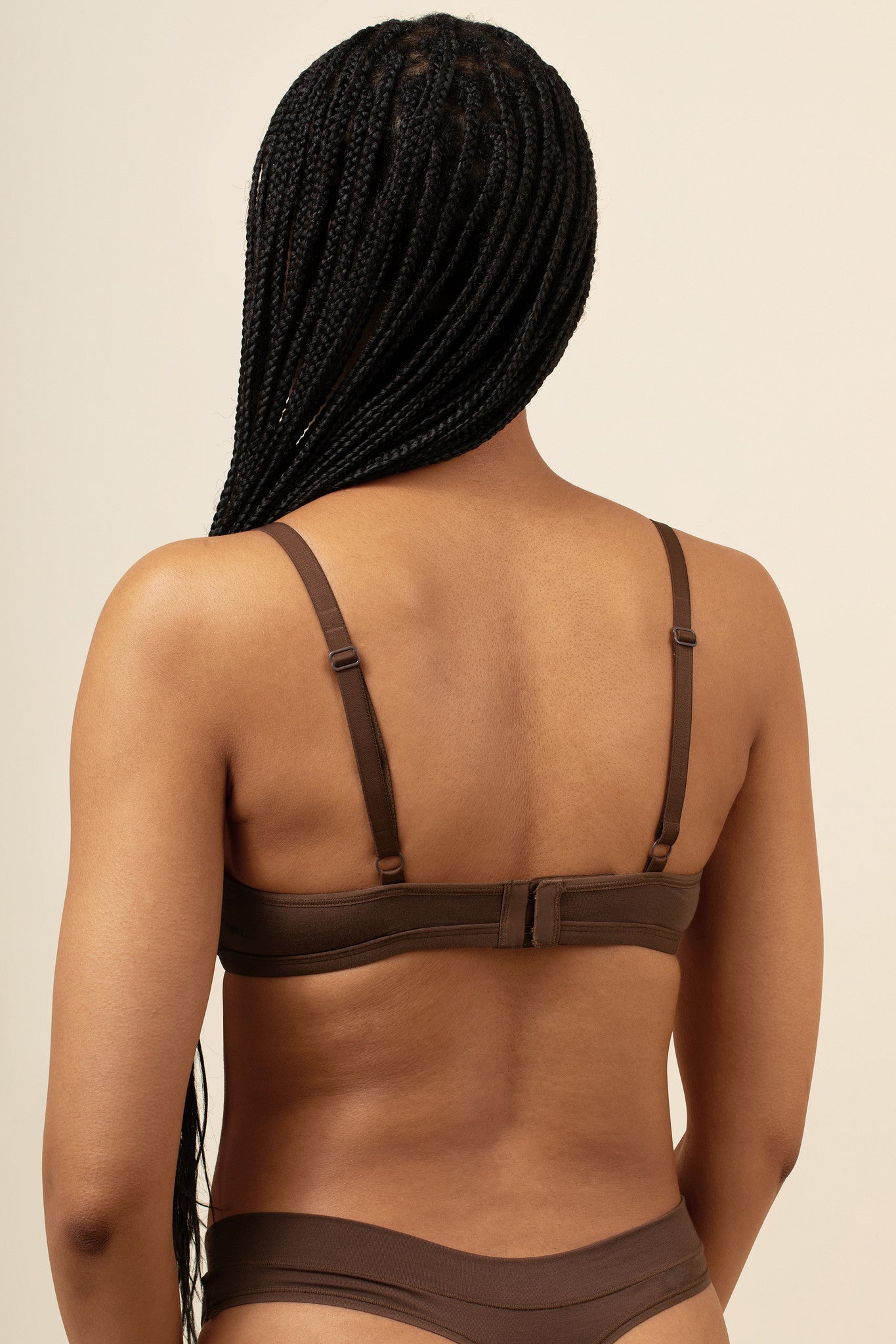 Back side of the Women's V Neck Bra in Toffee on a model wearing matching thong 
