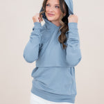 Model looking to the side with a hoodie while modeling the Kyte Women's French Terry Nursing Hoodie in Slate