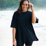Female model standing in the sand wearing the Women’s Biker Short Set in Midnight