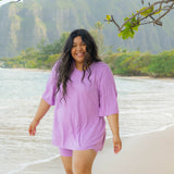 Smiling model in the Women’s Biker Short Set in Poi