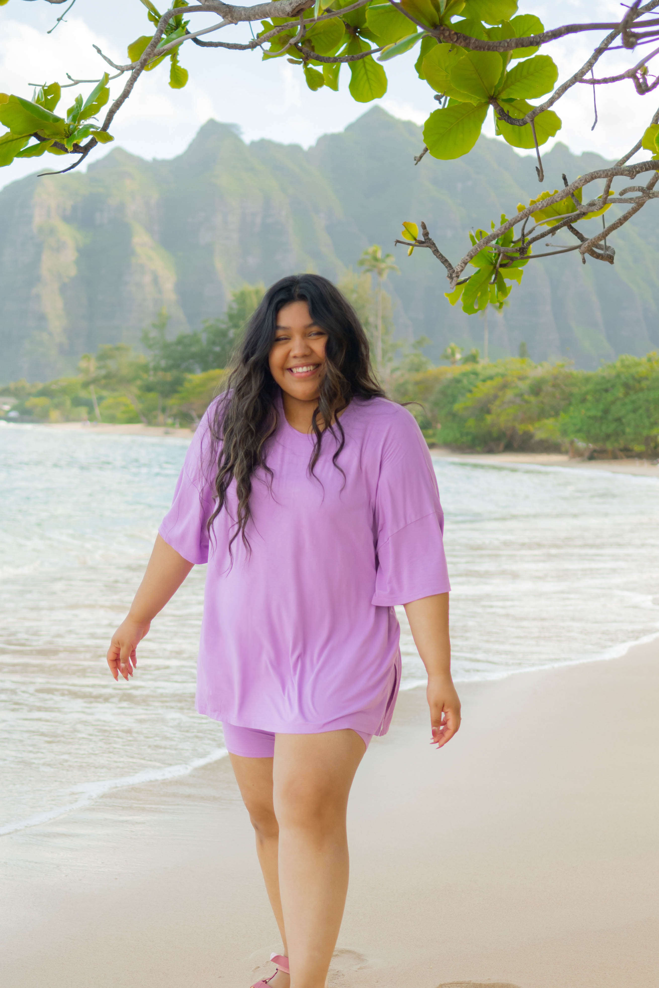 Smiling model in the Women’s Biker Short Set in Poi