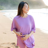 Female model in the sand on the beach wearing the Women’s Biker Short Set in Poi
