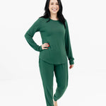 Model wearing Kyte Baby's Women's Jogger Pajama Set in Evergreen