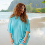 Female model on the beach wearing the Women’s Biker Short Set in Makai