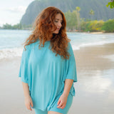 Female model on the beach wearing the Women’s Biker Short Set in Makai