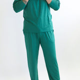Model wearing the Men's Lounge Pants in Emerald paired with matching Henley top
