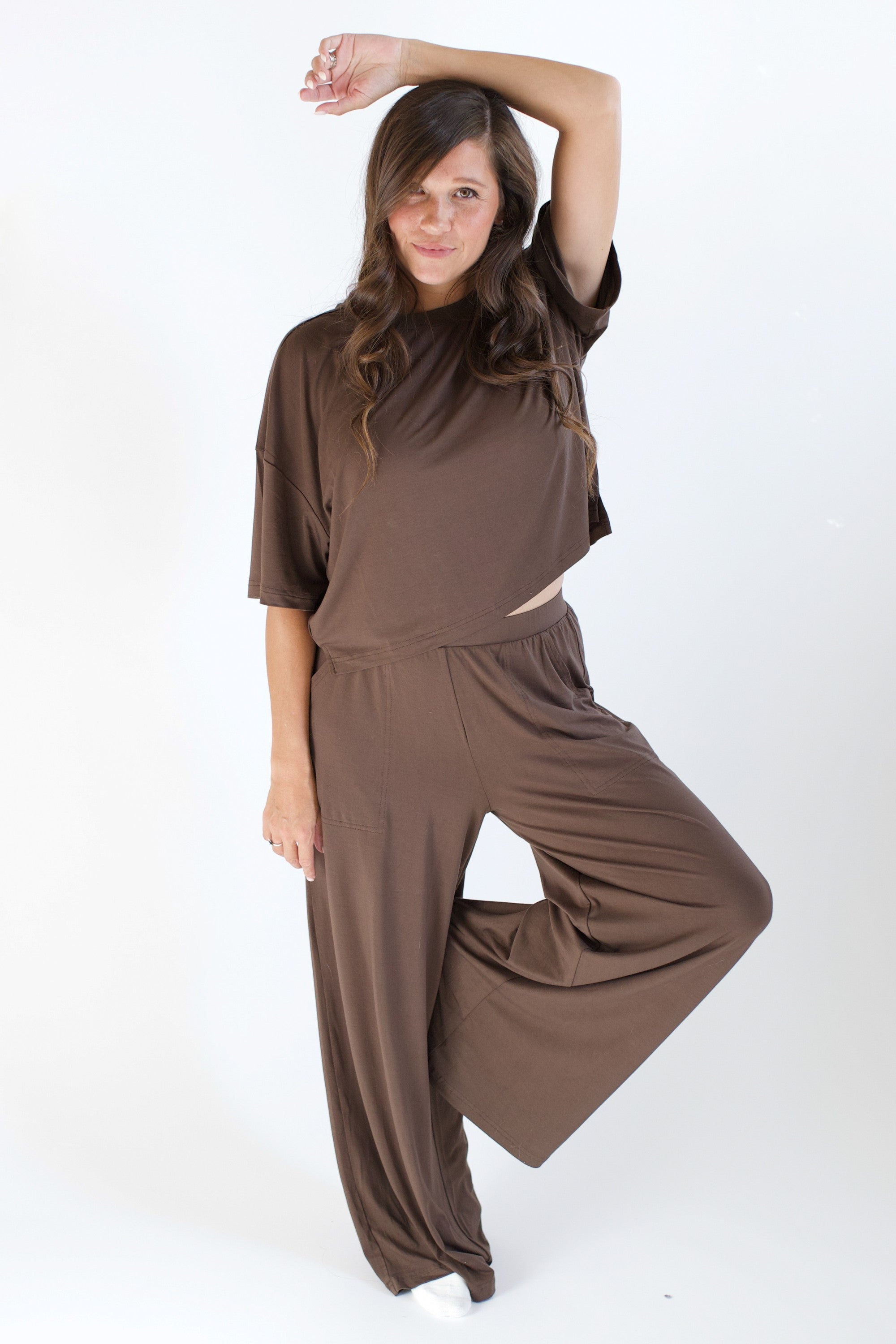 Model wearing the Women's Short Sleeve Tee in Espresso paired with the matching Wide Leg pants