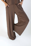 Close up of the Women's Wide Leg Pant in Espresso with one leg up