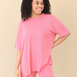 Female modeling Kyte Baby's Women’s Biker Short Set in Guava