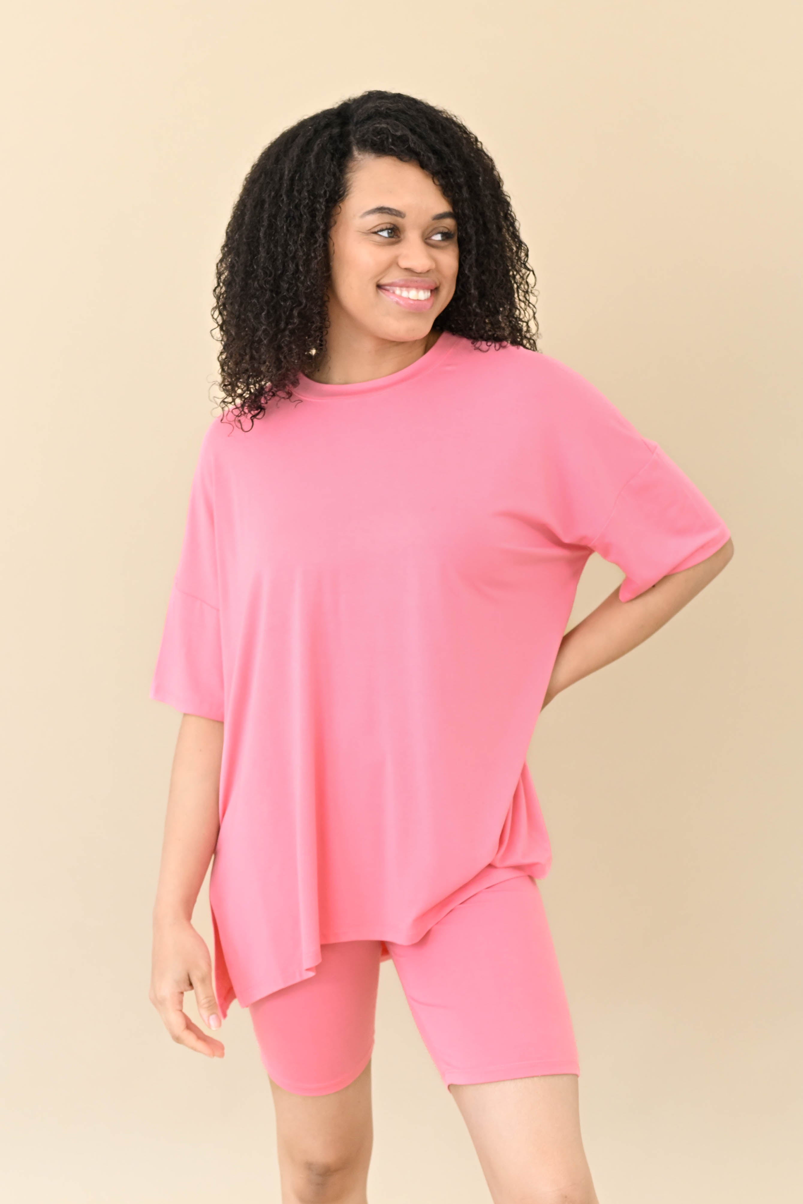 Female modeling Kyte Baby's Women’s Biker Short Set in Guava