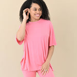 Female modeling the Women’s Biker Short Set in Guava