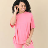 Female modeling the Women’s Biker Short Set in Guava