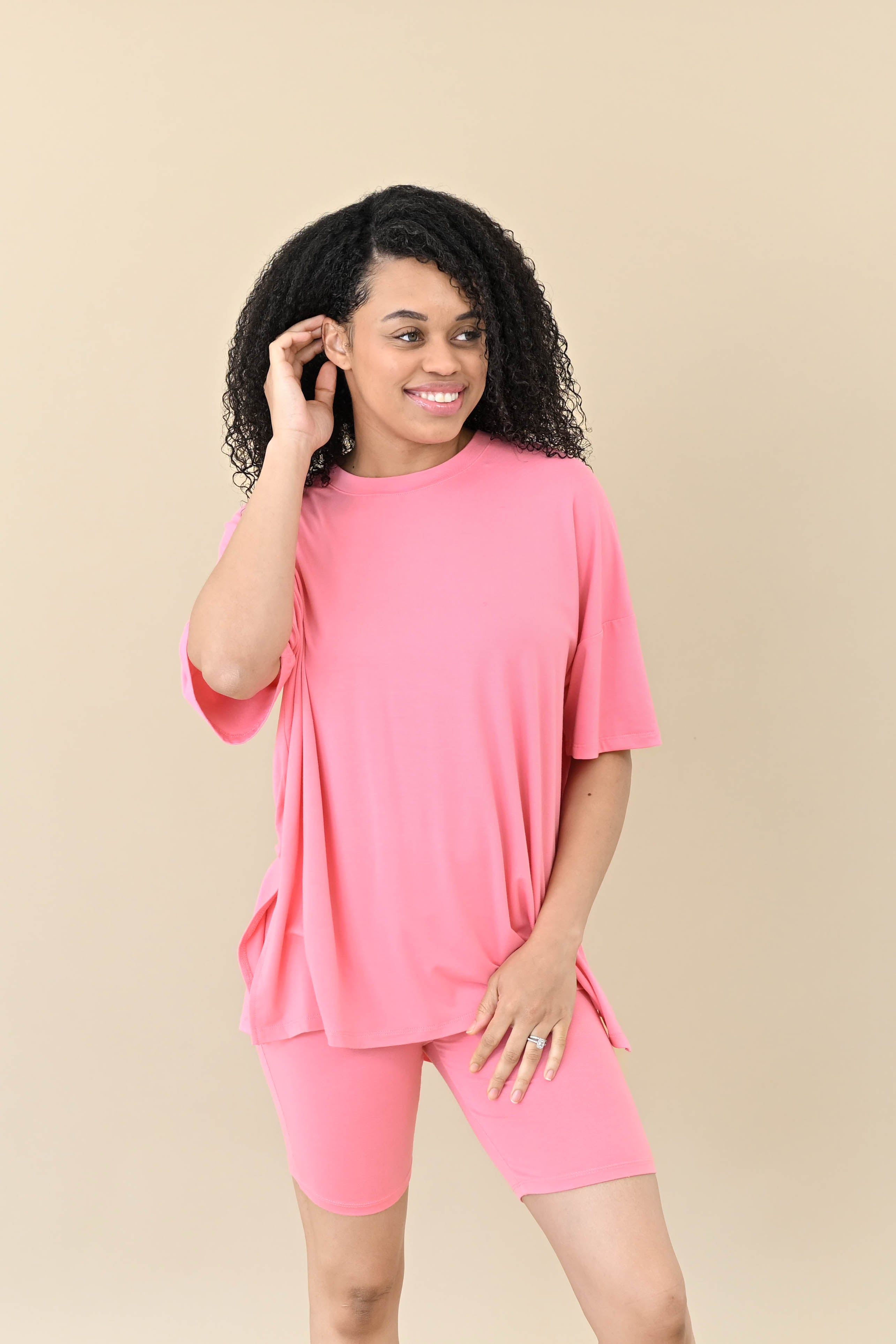 Female modeling the Women’s Biker Short Set in Guava