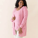 Female modeling the Bamboo Jersey Adult Cardigan in Apple Blossom paired with an Apple Blossom top and Oat pants