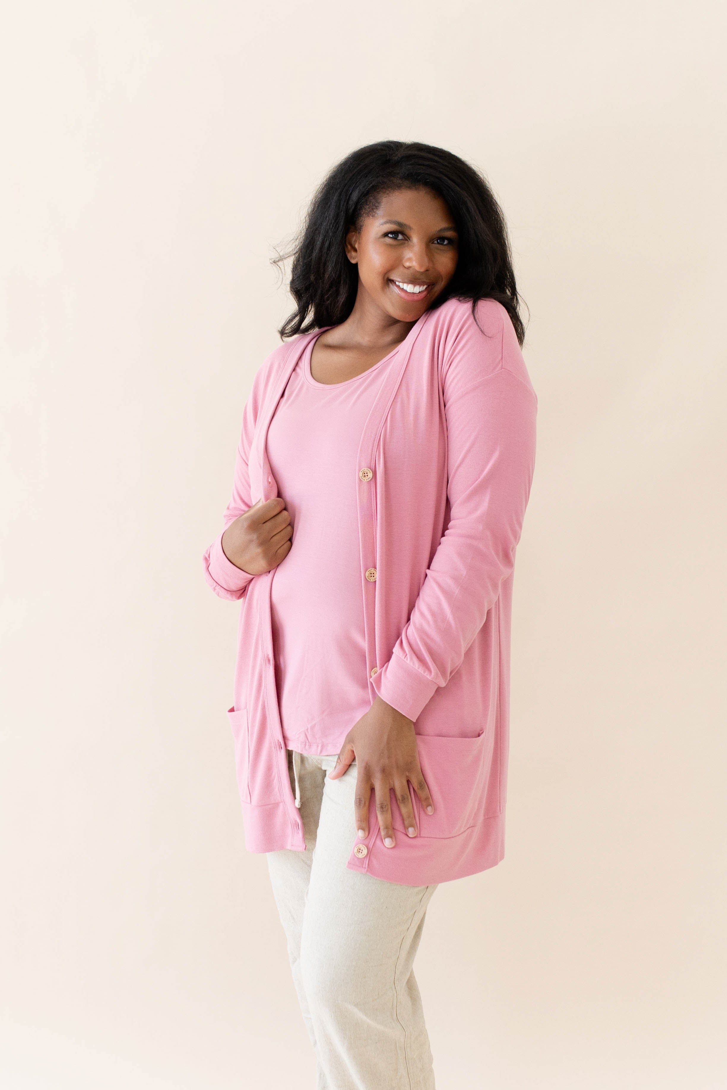 Female modeling the Bamboo Jersey Adult Cardigan in Apple Blossom paired with an Apple Blossom top and Oat pants