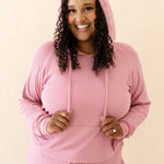 Model in the Women's Ribbed Hoodie in Apple Blossom paired with Apple Blossom Jogger Pants