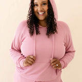 Model in the Women's Ribbed Hoodie in Apple Blossom paired with Apple Blossom Jogger Pants