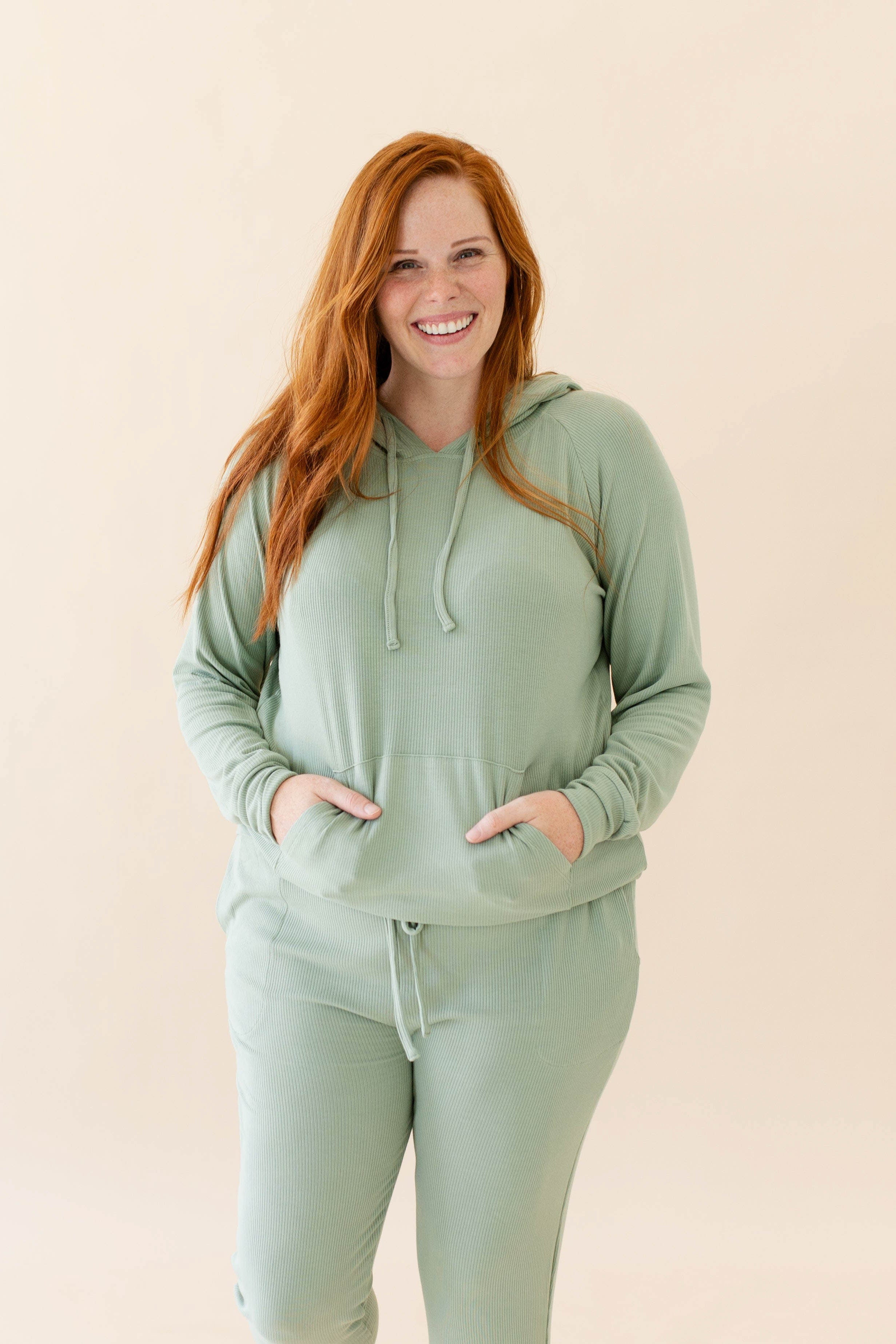 Model wearing the Women's Ribbed Hoodie in Thyme and Thyme Jogger Pants