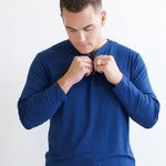 Male model unbutton the Men's Long Sleeve Henley Top in Tahoe