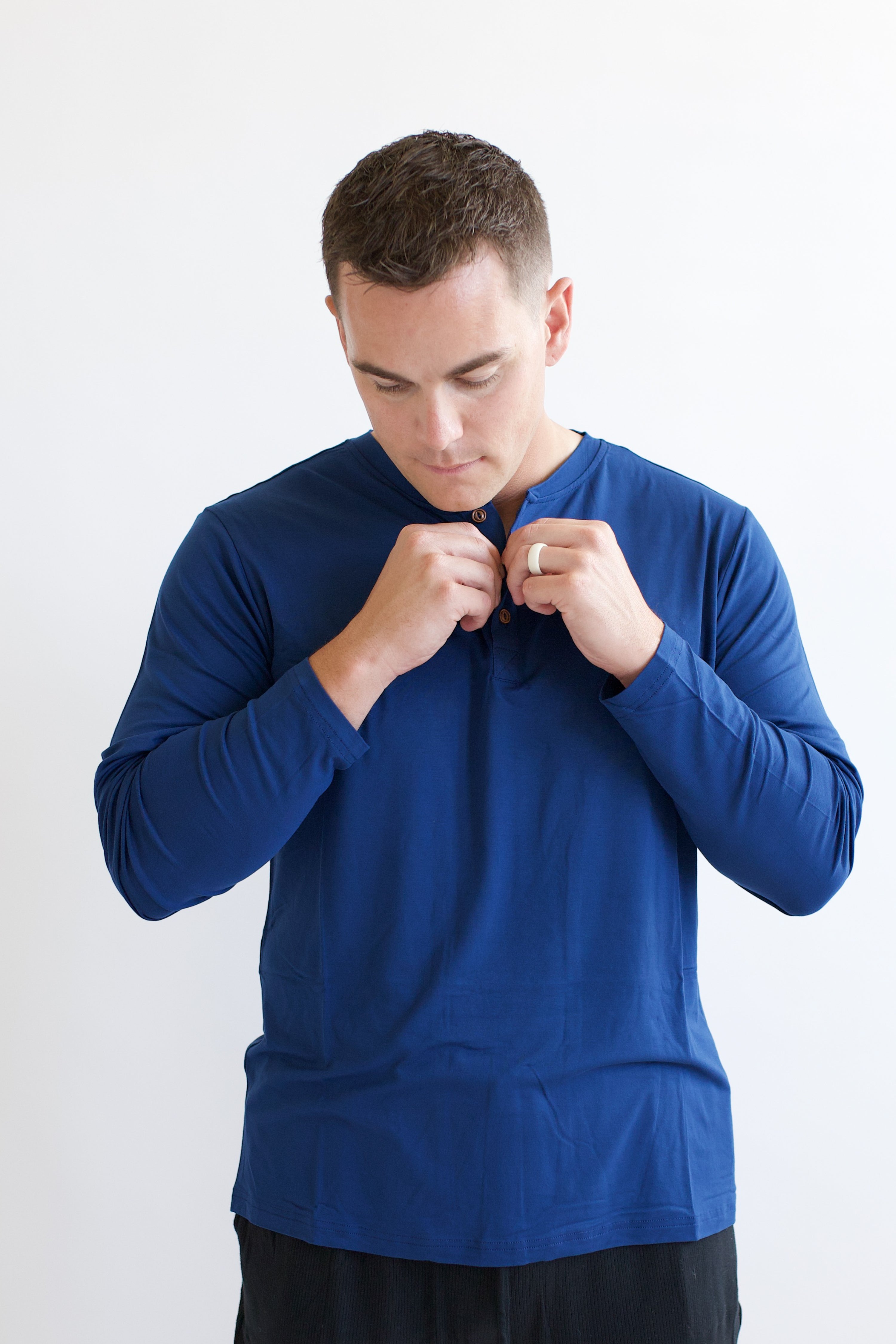 Male model unbutton the Men's Long Sleeve Henley Top in Tahoe