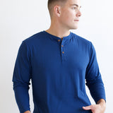 Male model looking to the side while wearing the Men's Long Sleeve Henley Top in Tahoe