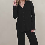 Woman modeling all black long sleeve bamboo pajama set
