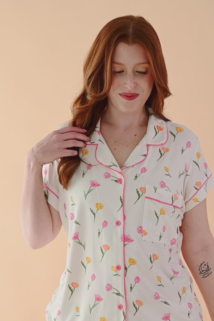 Video of model wearing short sleeve pajama set with tulip pattern  ::: Model is 5'7" wearing size M ///
