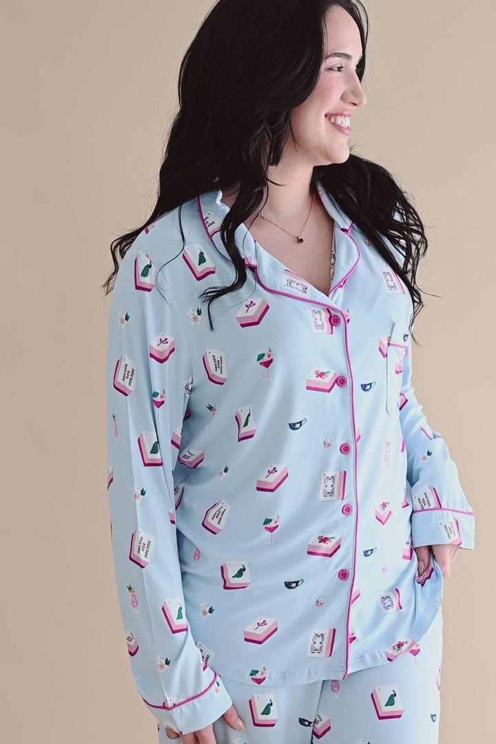 Woman modeling long sleeve button up blue pajama set with mahjong tile pattern 