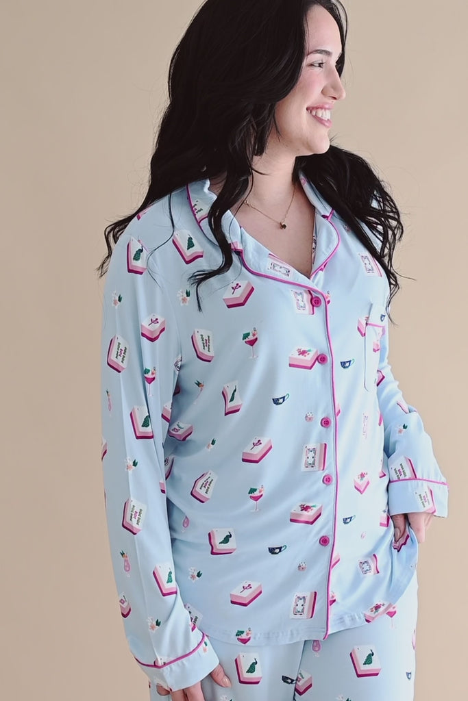 Woman modeling long sleeve button up blue pajama set with mahjong tile pattern ::: Model is 5'6" wearing size M ///