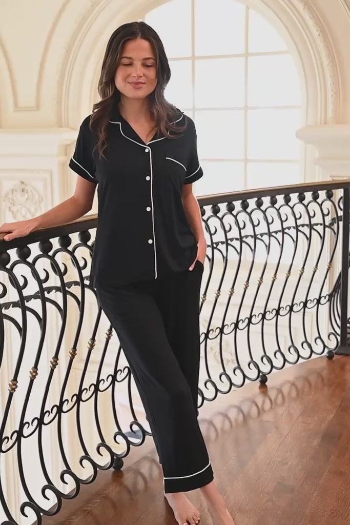 A video of a woman near a railing modeling and posing in cropped pajama bottoms and short sleeve top in midnight
::: Model is 5'9.5" wearing size S ///