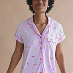 Video of model wearing short sleeve with cropped pant pajama set with cocktail print ::: Model is 5'9" wearing size S ///