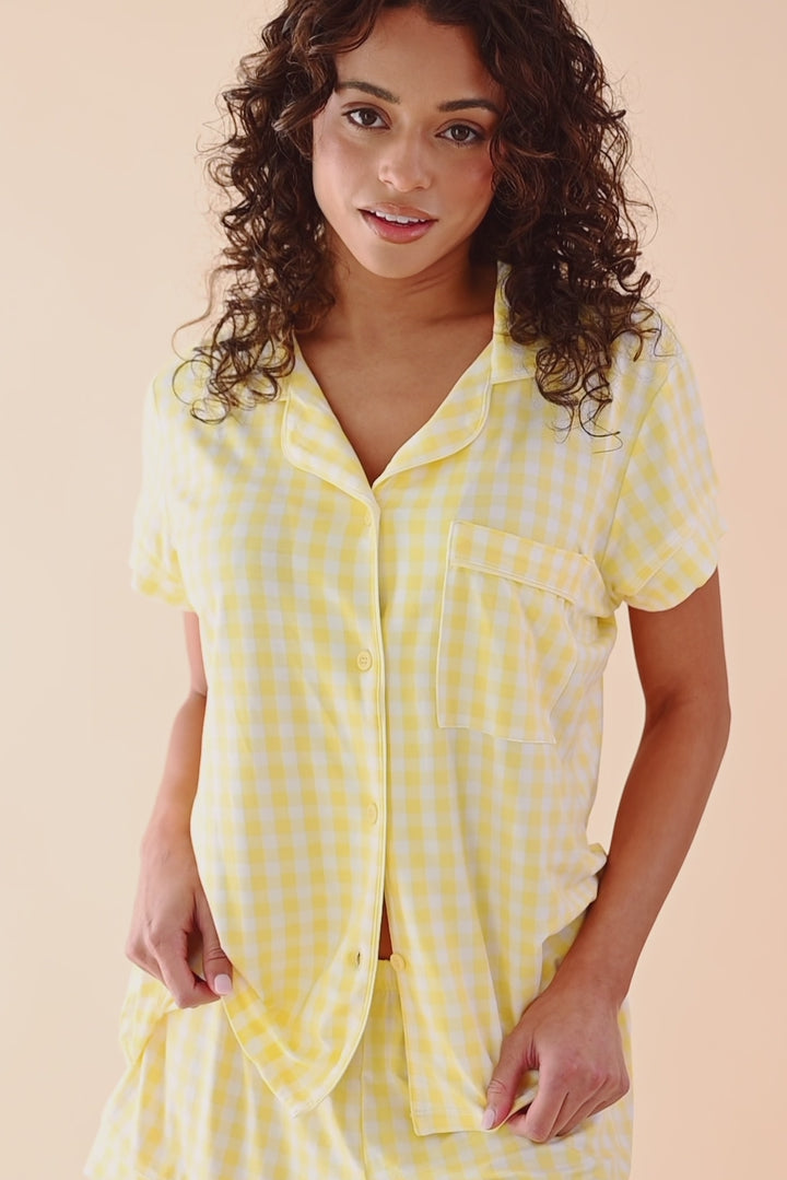 Video of woman modeling short sleeve gingham pattern yellow pajama set 