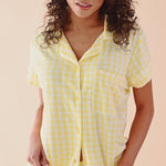 Video of woman modeling short sleeve gingham pattern yellow pajama set ::: Model is 5'3" wearing size XS ///